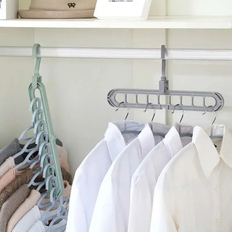 SpaceFold hanger on a closet rod with clothes